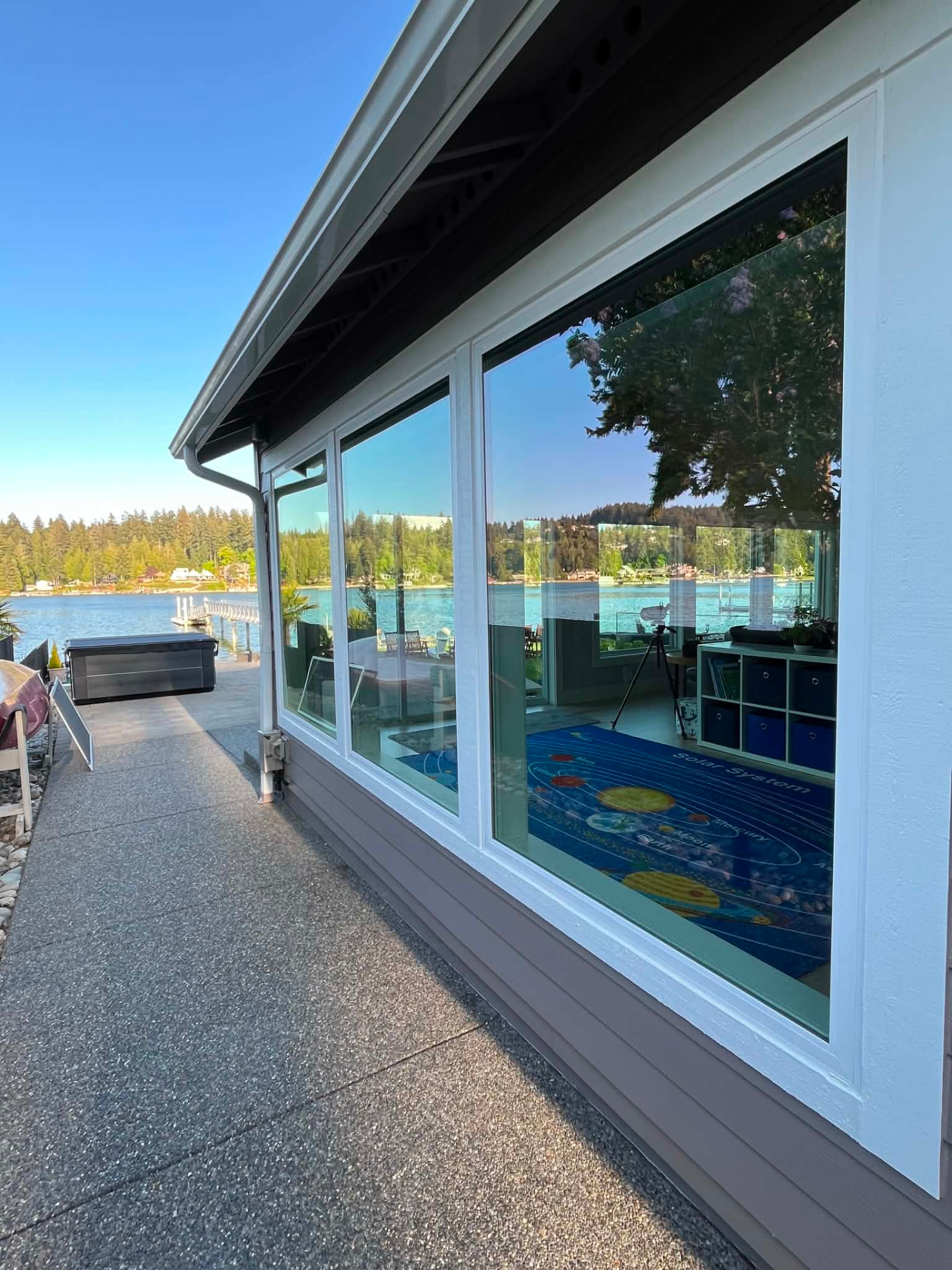 Spotless floor-to-ceiling windows on a lakefront home